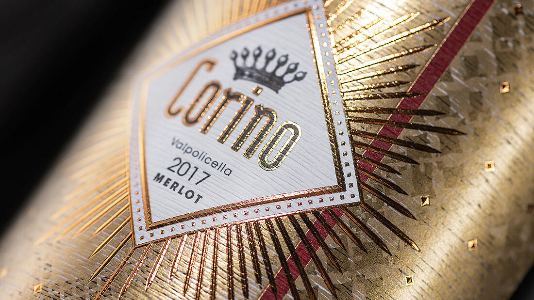 Detail of white gold wine label with gold decorations and lettering