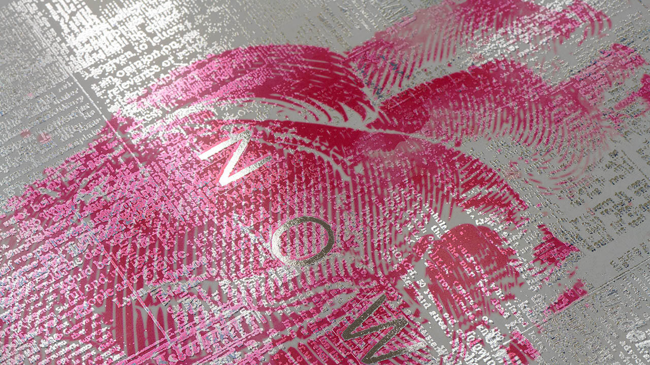 Print with the word “NOW” in pink and silver metallics, showcasing digital metallization.