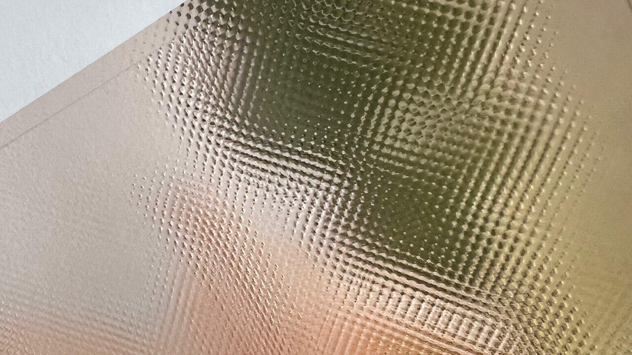 Detail of a hot-stamped sheet print with relief effect