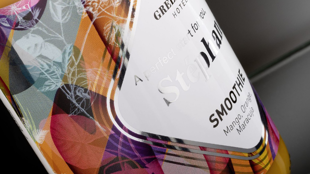 Increase the attraction of your product with digital printing Bottle with sparkling silver lines framing product name and floral design as background