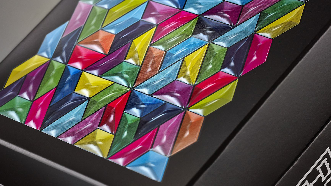 Packaging detail with colored 3D mosaic design, realized with hot stamping